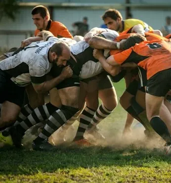 Men playing rugby