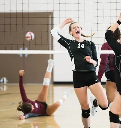 Women playing volleyball